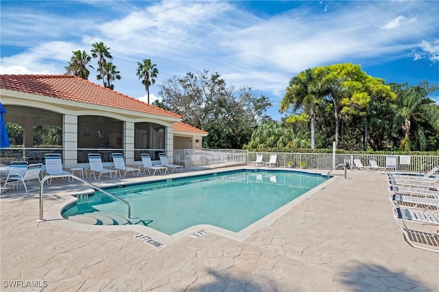 view of swimming pool featuring a patio area