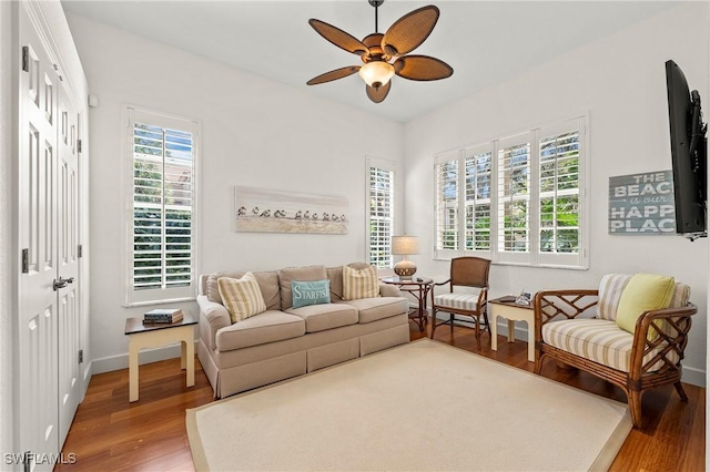 living room featuring hardwood / wood-style floors, a wealth of natural light, and ceiling fan