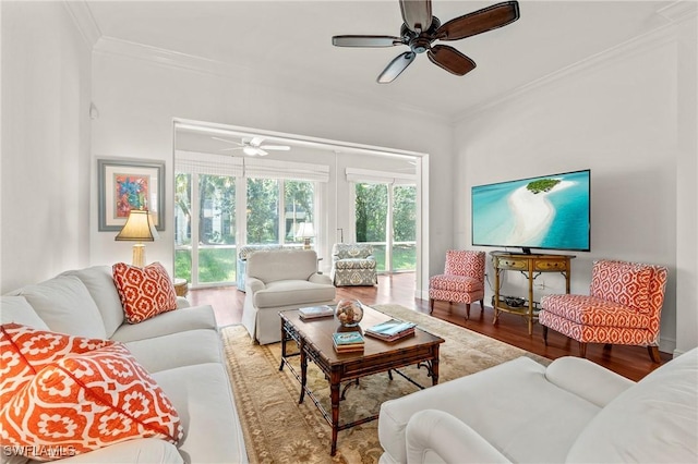 living room featuring ceiling fan, hardwood / wood-style floors, and ornamental molding