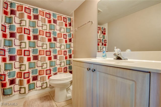 full bathroom with curtained shower, vanity, toilet, and tile patterned floors