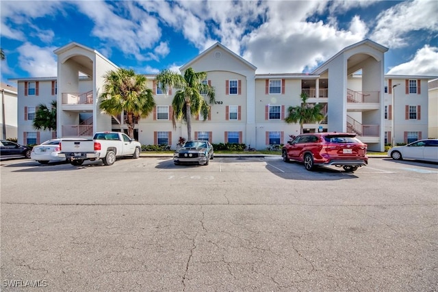 view of property featuring uncovered parking