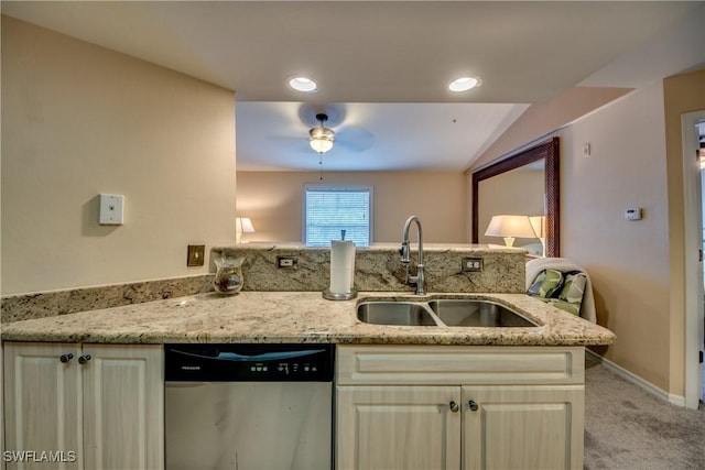 kitchen with light stone counters, light colored carpet, a sink, dishwasher, and a peninsula