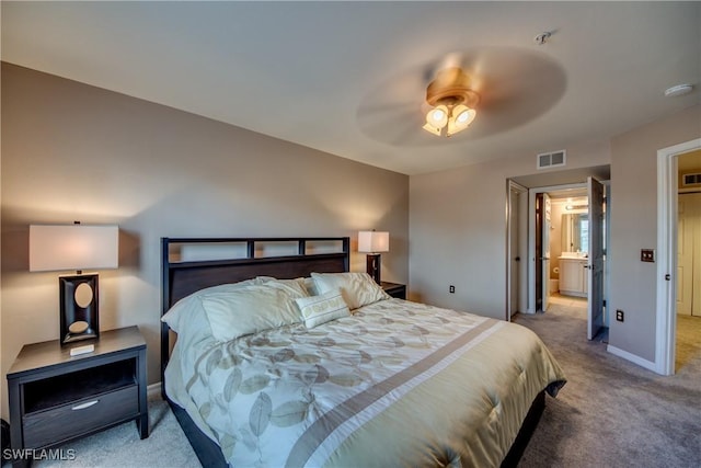 bedroom with baseboards, a ceiling fan, visible vents, and light colored carpet