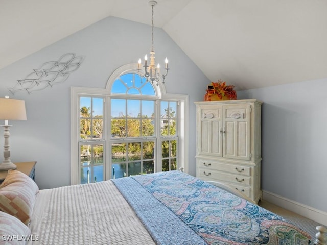 bedroom with vaulted ceiling and a notable chandelier