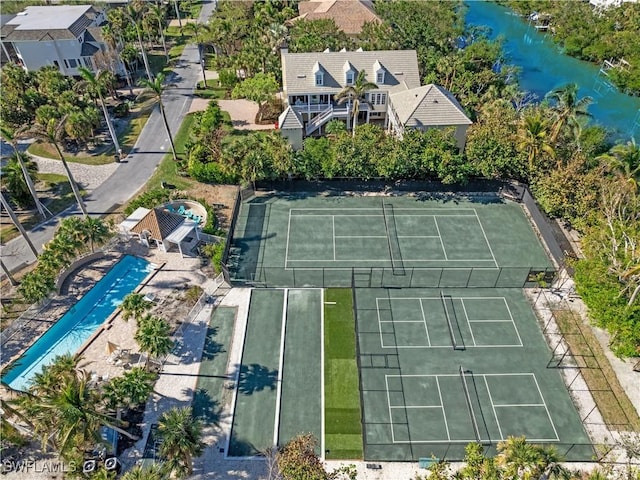 birds eye view of property with a water view