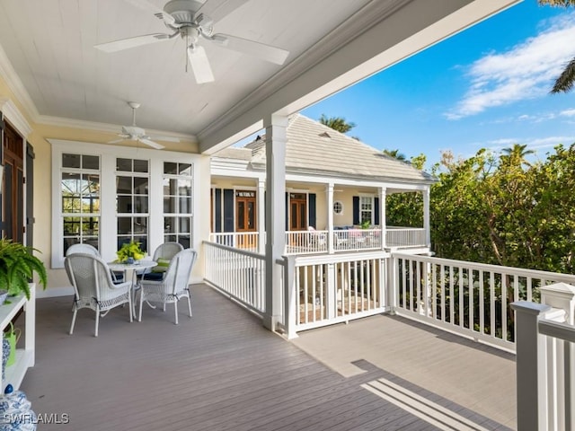 wooden deck with ceiling fan and covered porch