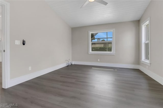 empty room featuring dark hardwood / wood-style floors, ceiling fan, and wooden ceiling