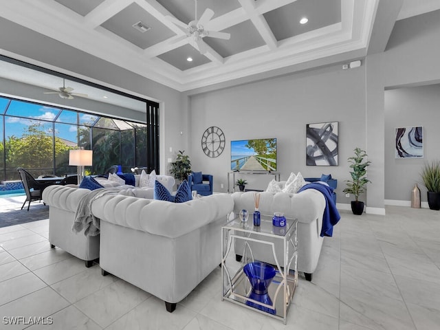 living room with beamed ceiling, a high ceiling, and coffered ceiling