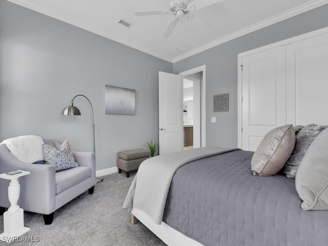 bedroom with light colored carpet, ceiling fan, and crown molding