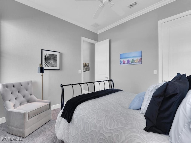 carpeted bedroom featuring ceiling fan and ornamental molding