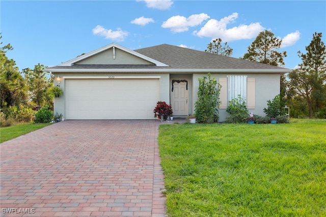 ranch-style home featuring a front lawn and a garage