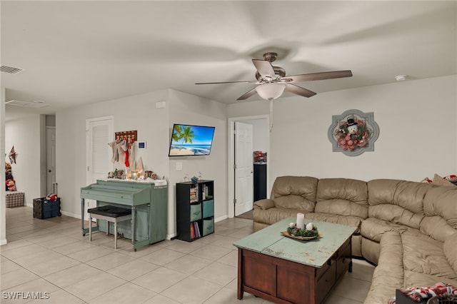 living room with light tile patterned floors and ceiling fan