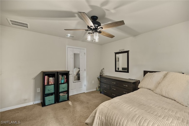 bedroom with ceiling fan and light carpet