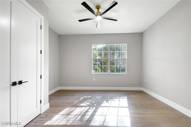 unfurnished bedroom featuring ceiling fan and light wood-type flooring