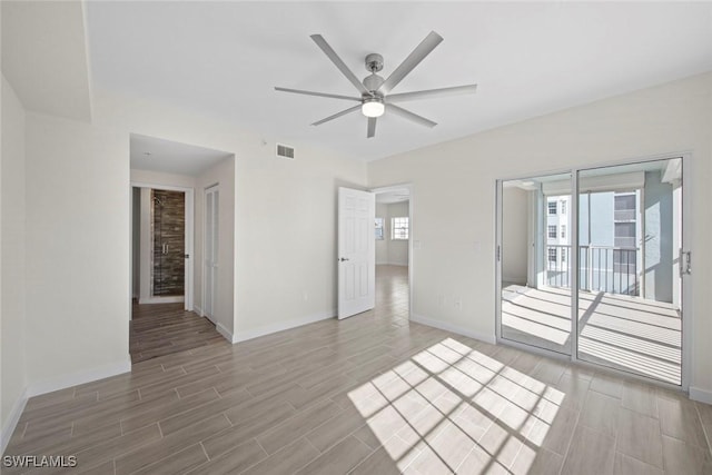 unfurnished room with ceiling fan