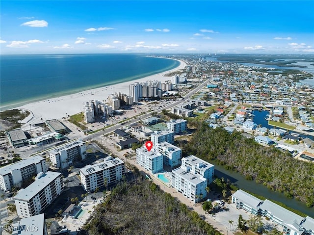 drone / aerial view with a view of the beach and a water view