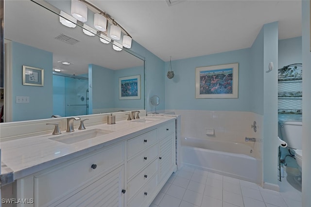 bathroom with double vanity, toilet, visible vents, and a sink