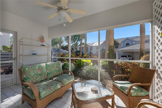 sunroom featuring a wealth of natural light and ceiling fan