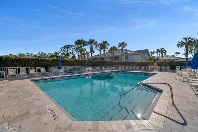 view of swimming pool featuring a patio area