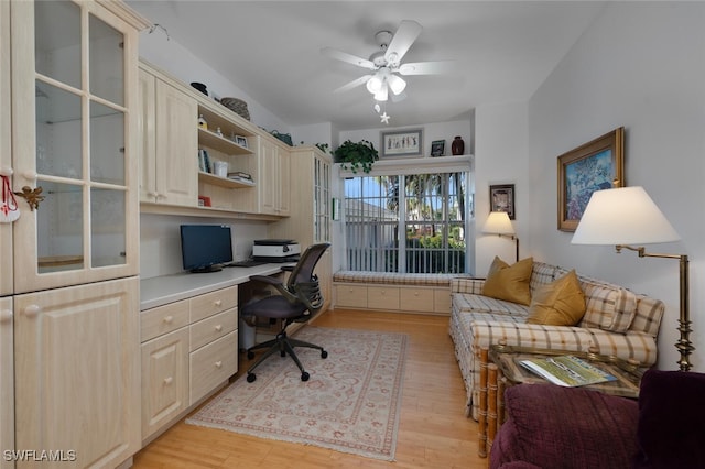 office with ceiling fan, light wood-style flooring, and built in study area