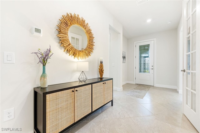 entryway featuring light tile patterned floors