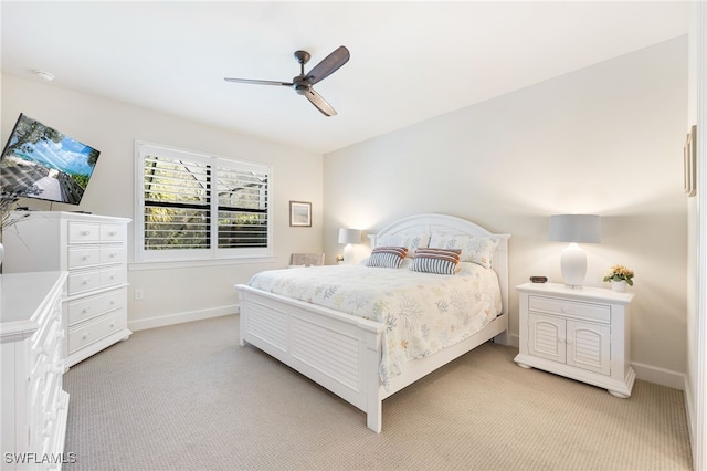 bedroom featuring ceiling fan and light colored carpet