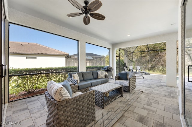 sunroom / solarium with ceiling fan