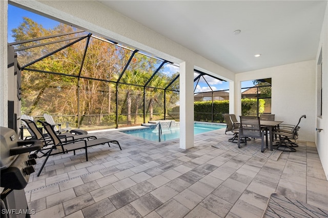 pool with outdoor dining space, a lanai, a patio, and grilling area