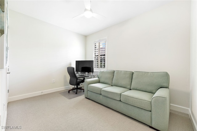 carpeted office featuring ceiling fan