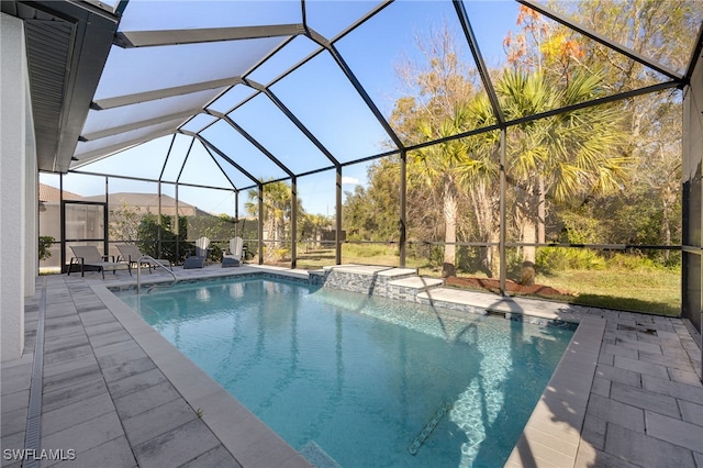 view of pool with a mountain view, a patio, and a lanai