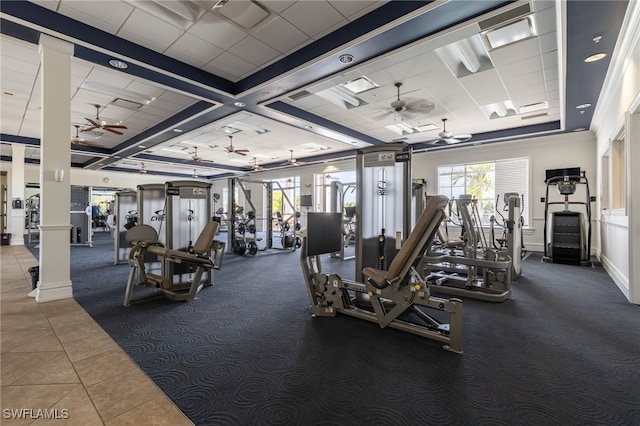 gym featuring tile patterned flooring and ornamental molding