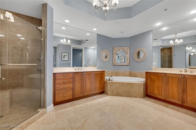 bathroom featuring separate shower and tub and vanity