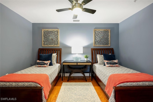 bedroom featuring ceiling fan and light wood-type flooring