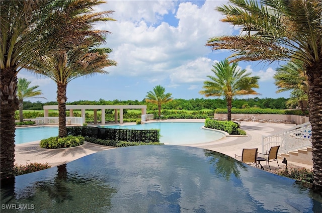 view of swimming pool featuring a patio