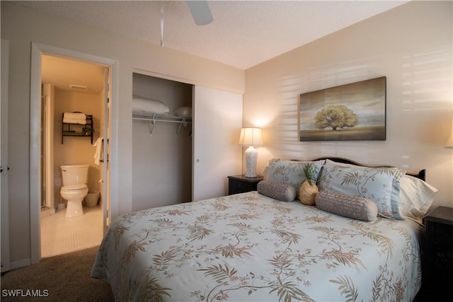 bedroom with carpet flooring, ceiling fan, a textured ceiling, connected bathroom, and a closet