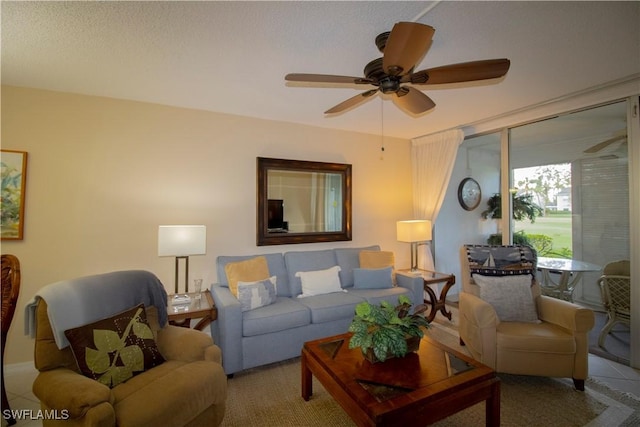 carpeted living room with ceiling fan