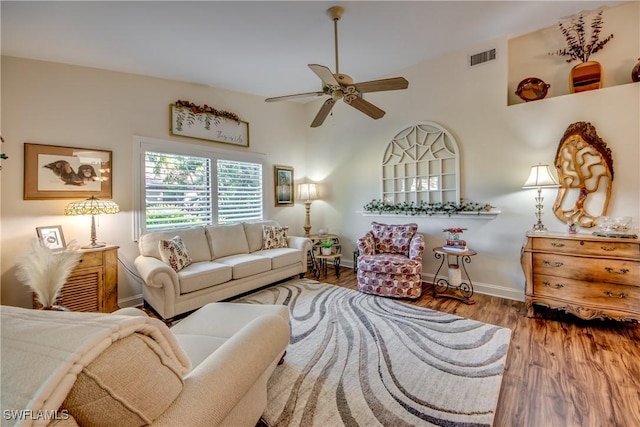 living room featuring hardwood / wood-style flooring and ceiling fan