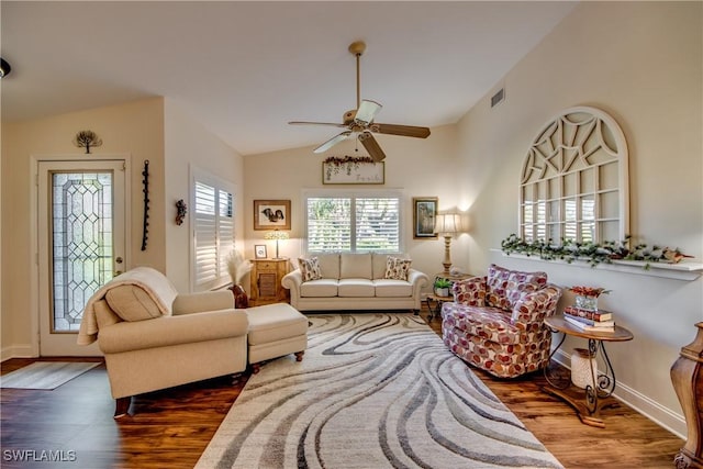 living room featuring dark wood-type flooring, ceiling fan, and lofted ceiling