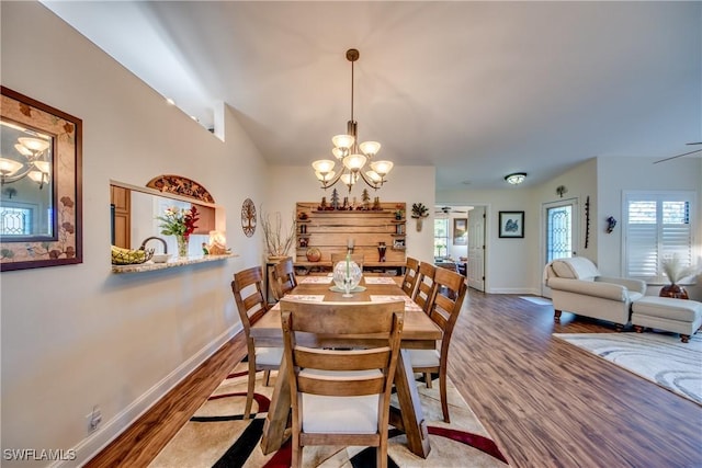 dining room featuring a notable chandelier and wood-type flooring