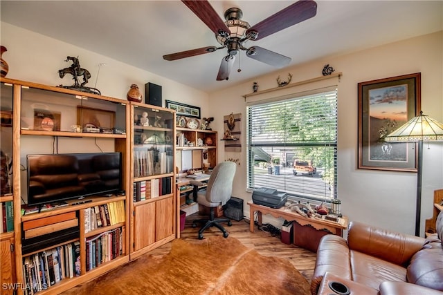 office space featuring ceiling fan and light wood-type flooring