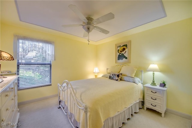 bedroom with ceiling fan and light colored carpet