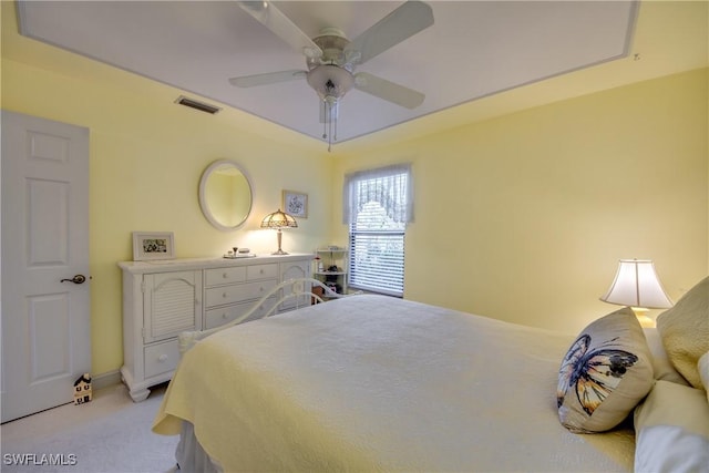 bedroom featuring light carpet and ceiling fan