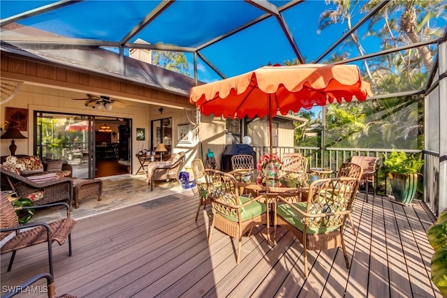 wooden terrace with glass enclosure and ceiling fan