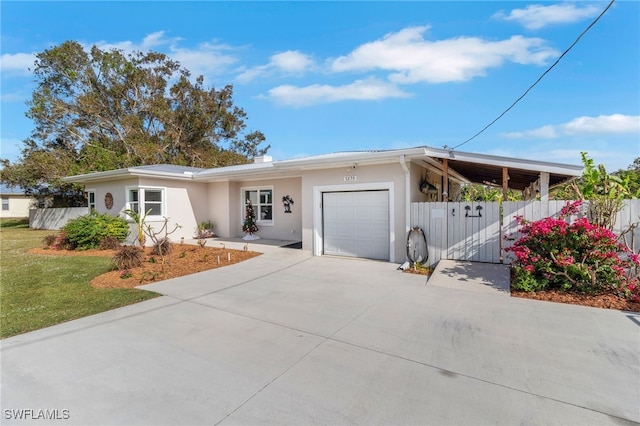 ranch-style home featuring a garage and a front yard