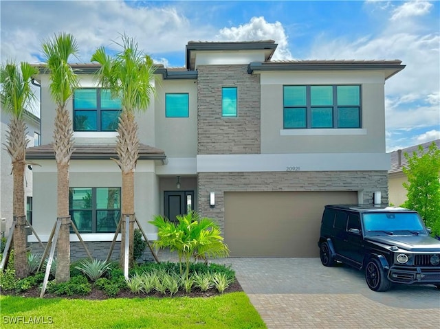 view of front of property with a garage