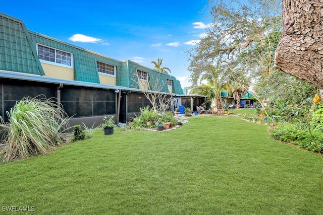 view of yard with a sunroom