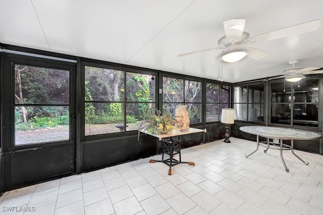 sunroom / solarium with ceiling fan