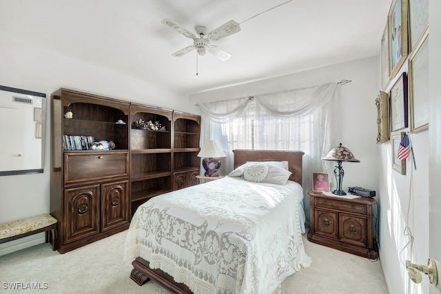 bedroom with light colored carpet and ceiling fan