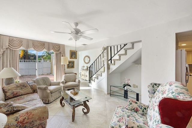 living room with ceiling fan and light tile patterned floors