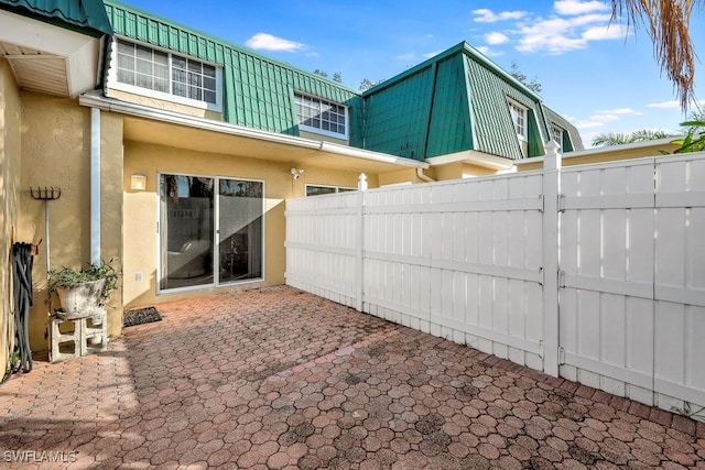 rear view of property with a patio area